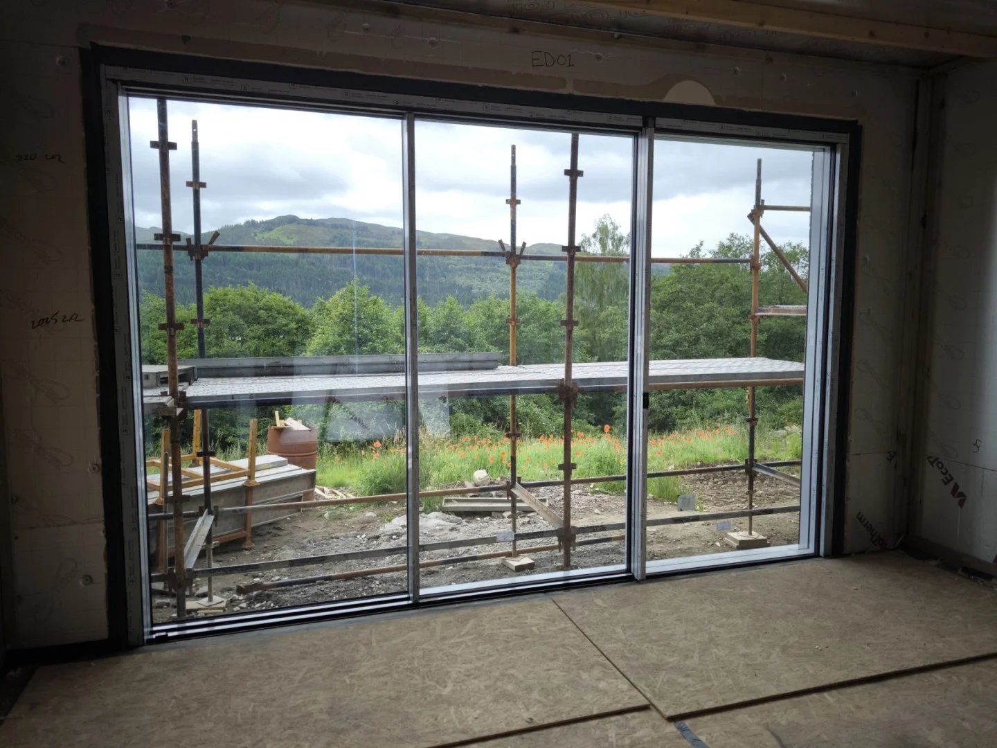 Reynaers Aluminium Hifinity sliding door system in Scotland Highlands house installed by Fenstercraft Aluminium